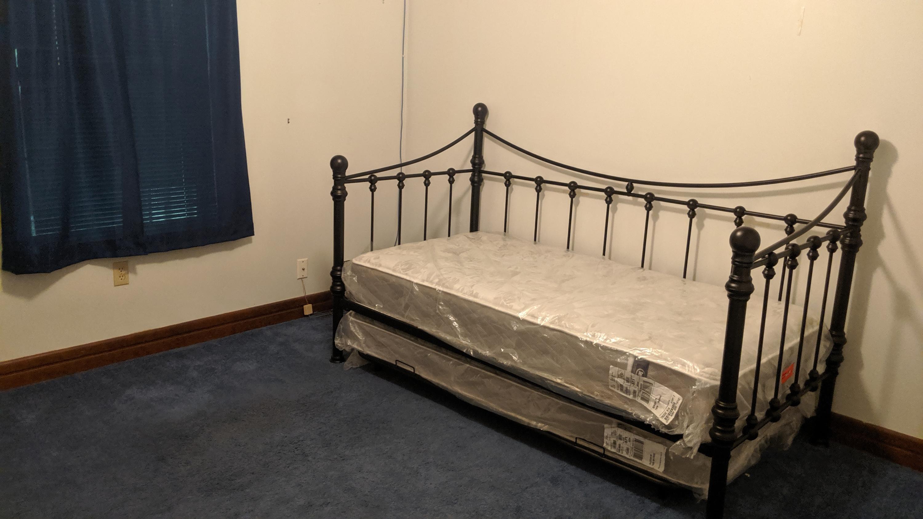 602 Valley Road Crestview, FL 32539 - Photo 23 of 34 a bed sitting in a bedroom next to a window