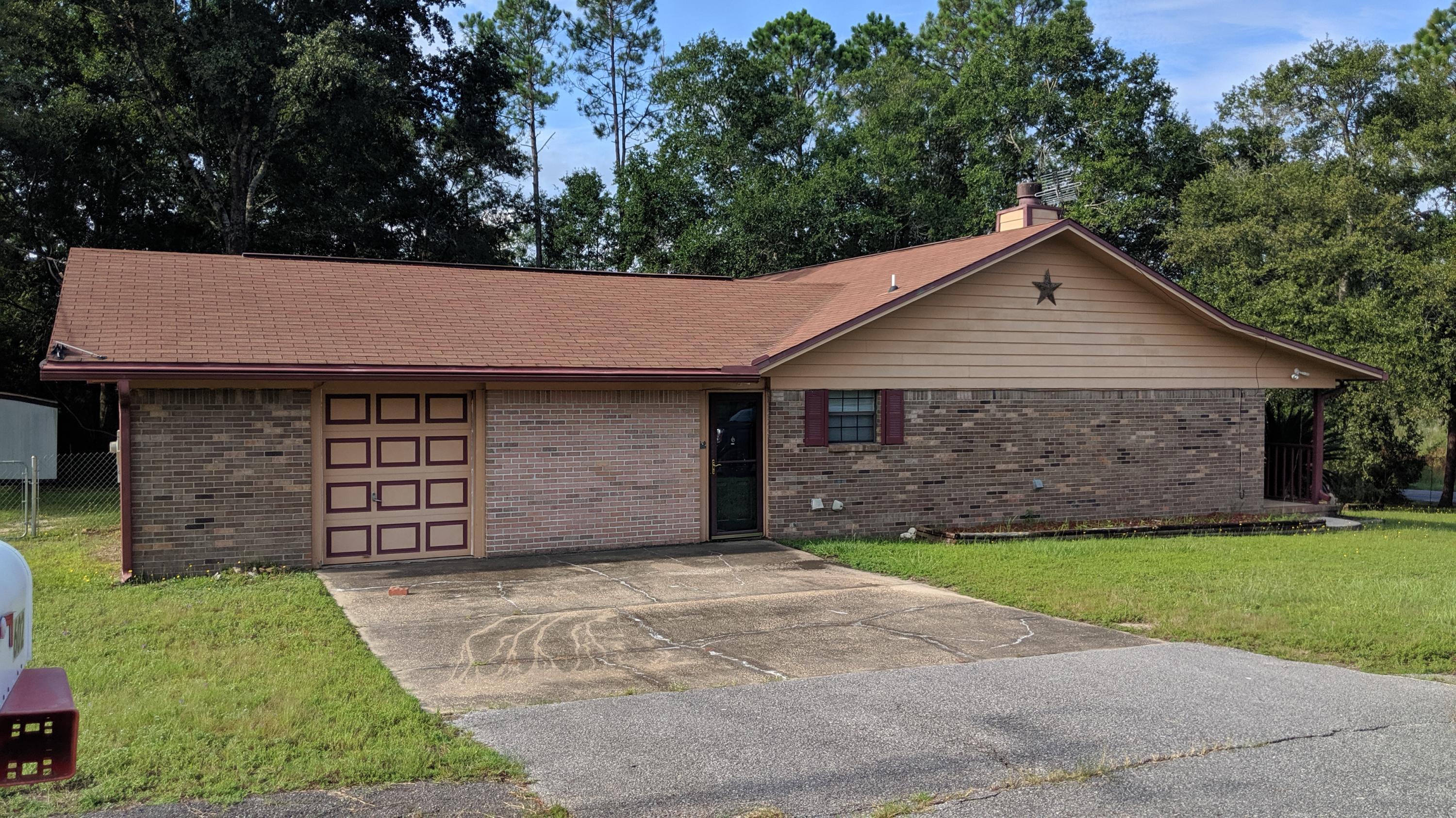 602 Valley Road Crestview, FL 32539 - Photo 25 of 34 a front view of a house with a garden