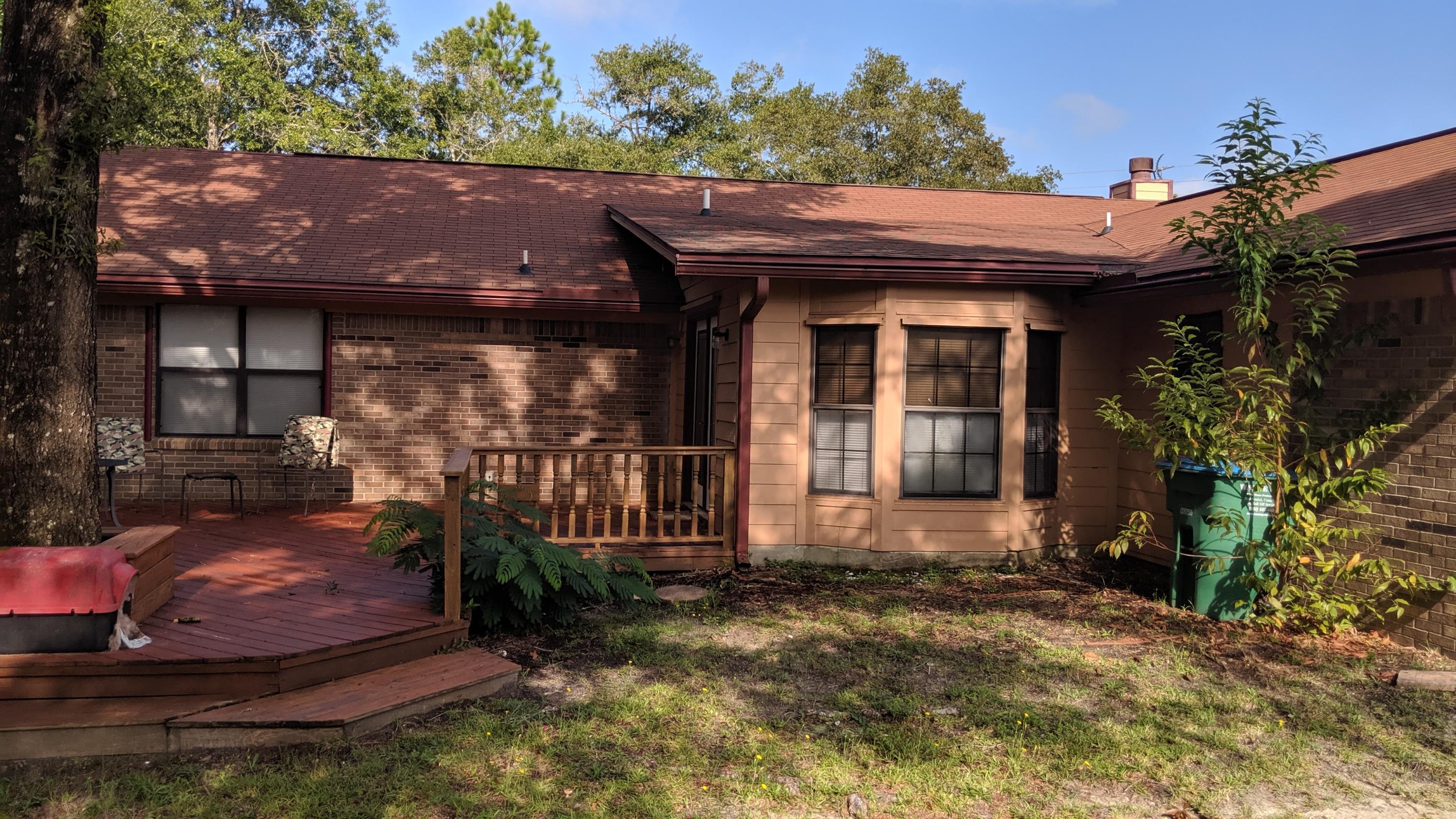 602 Valley Road Crestview, FL 32539 - Photo 27 of 34 a view of a house with a small yard and plants