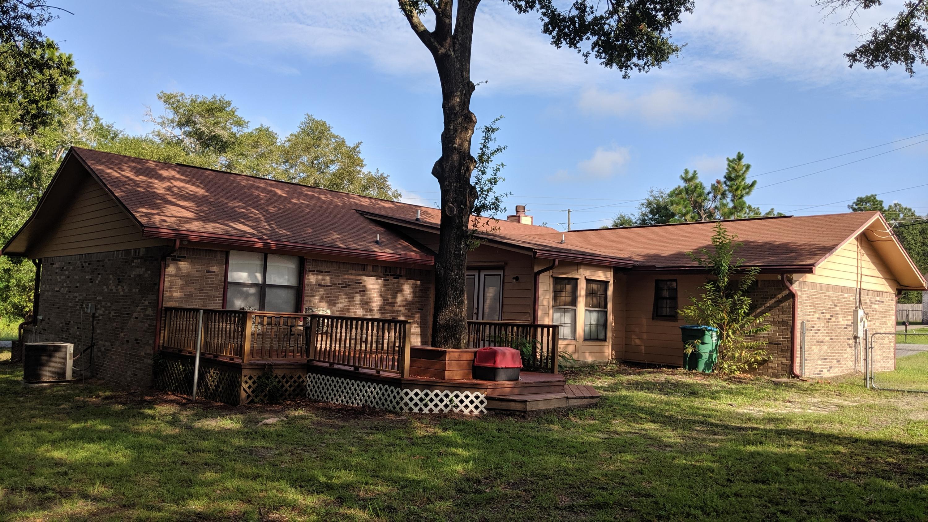 602 Valley Road Crestview, FL 32539 - Photo 28 of 34 a view of a house with a yard