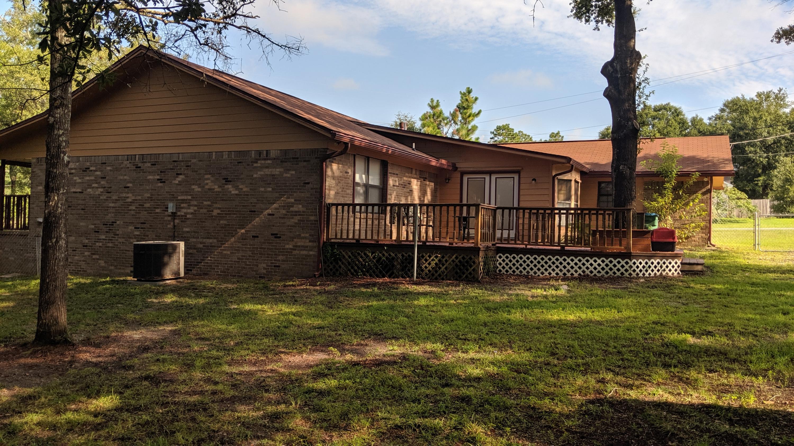 602 Valley Road Crestview, FL 32539 - Photo 29 of 34 a view of a house with a yard