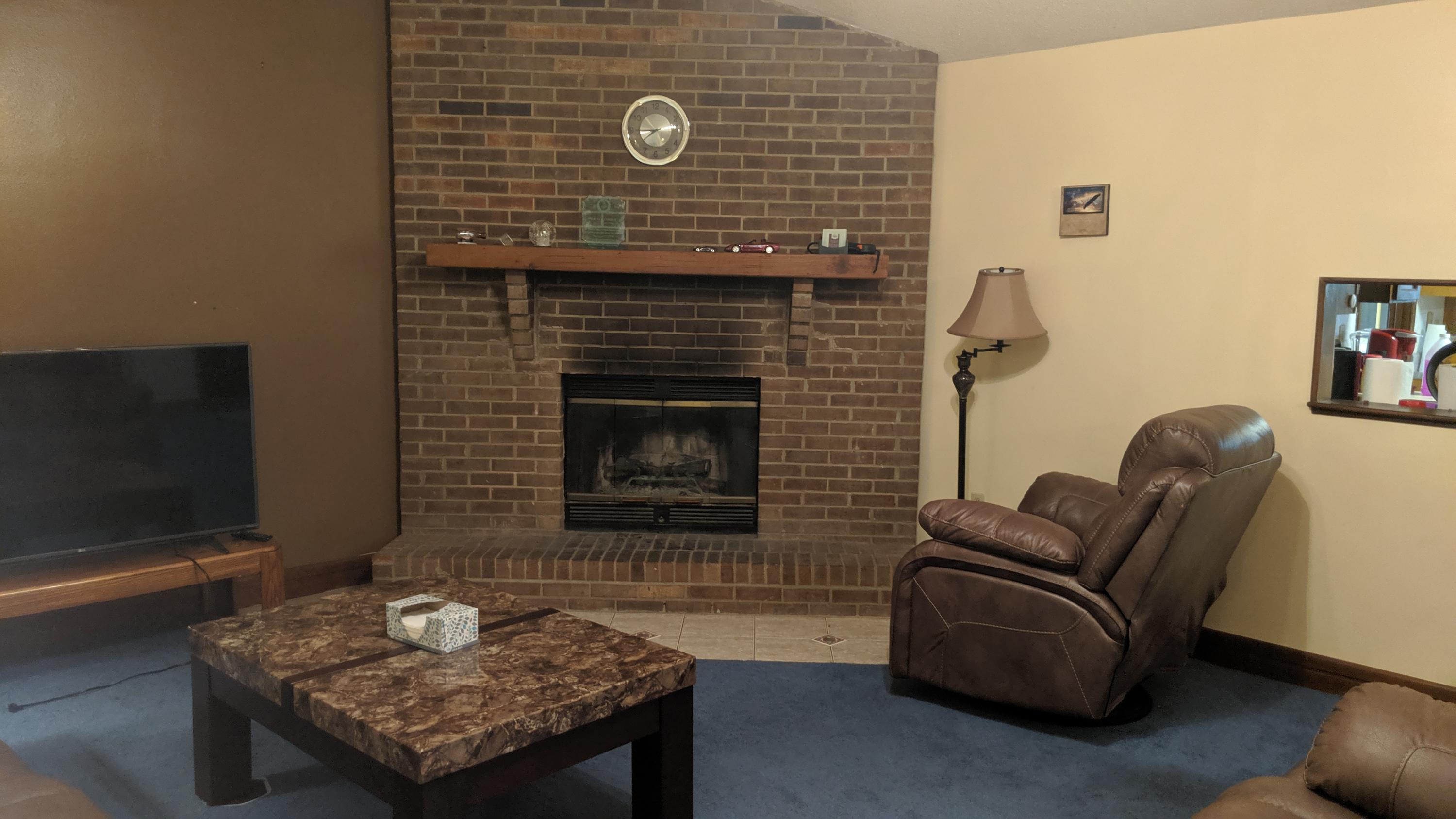602 Valley Road Crestview, FL 32539 - Photo 8 of 34 a living room with furniture and a fireplace