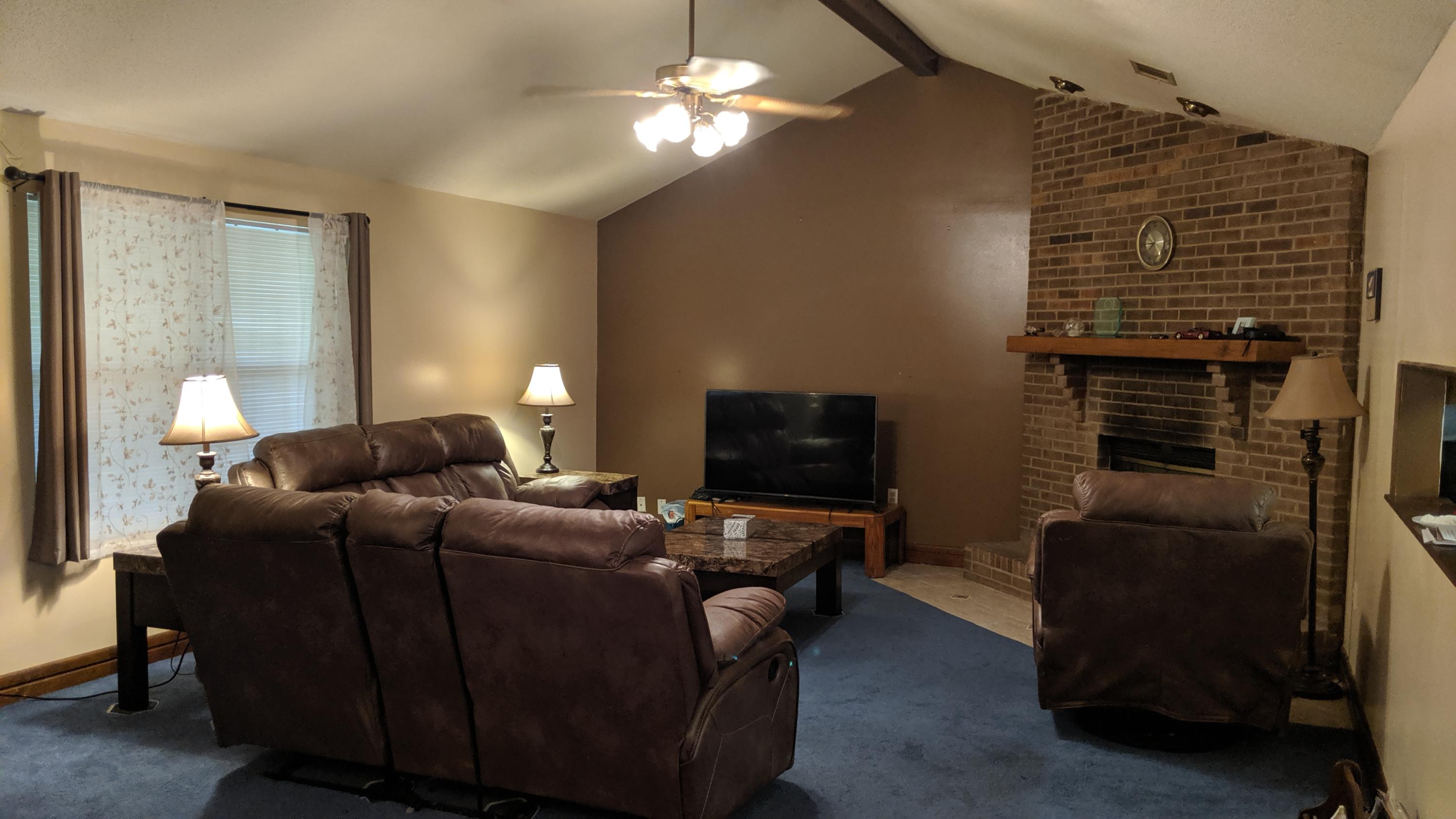 602 Valley Road Crestview, FL 32539 - Photo 9 of 34 a bedroom with a bed and a couch