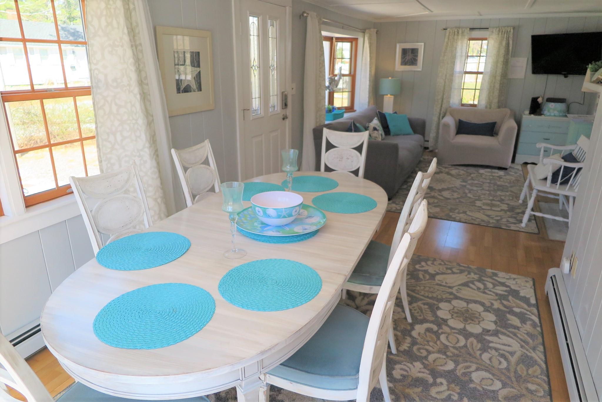 42 Bain Road Dennis Port, MA 02639 - Photo 11 of 46 a view of a dining room with furniture