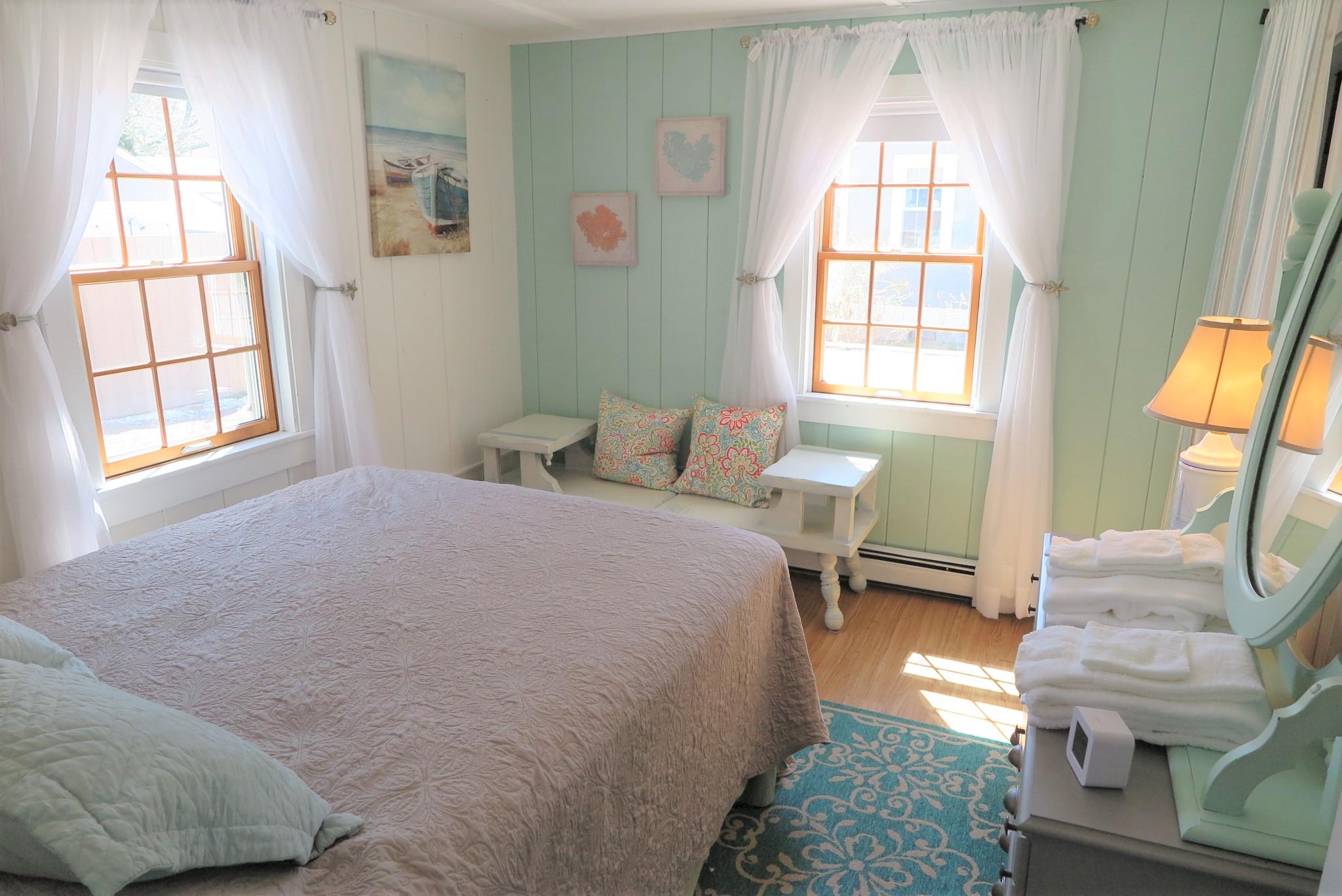 42 Bain Road Dennis Port, MA 02639 - Photo 19 of 46 a bedroom with a bed and a window