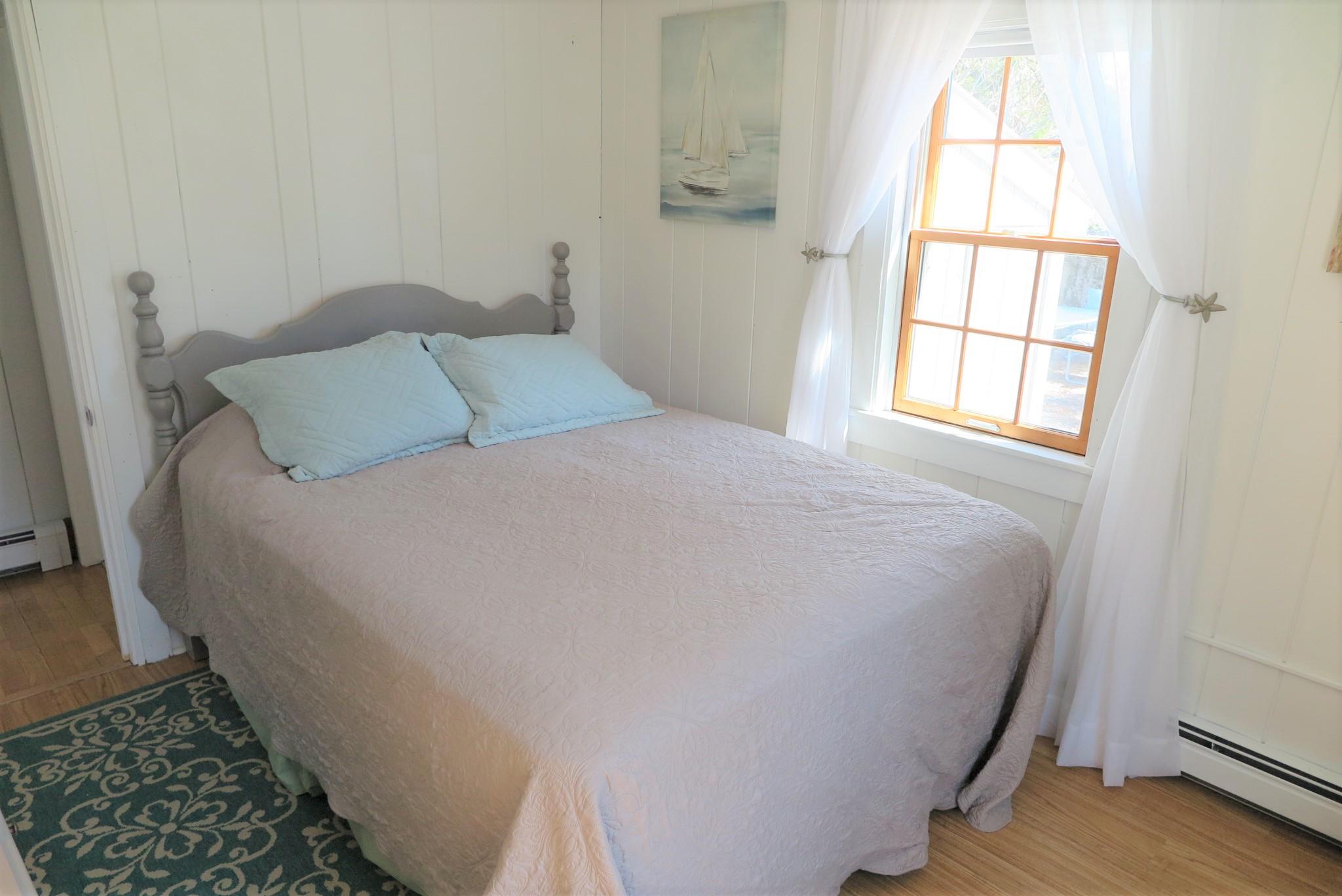 42 Bain Road Dennis Port, MA 02639 - Photo 20 of 46 a bedroom with a bed and a window