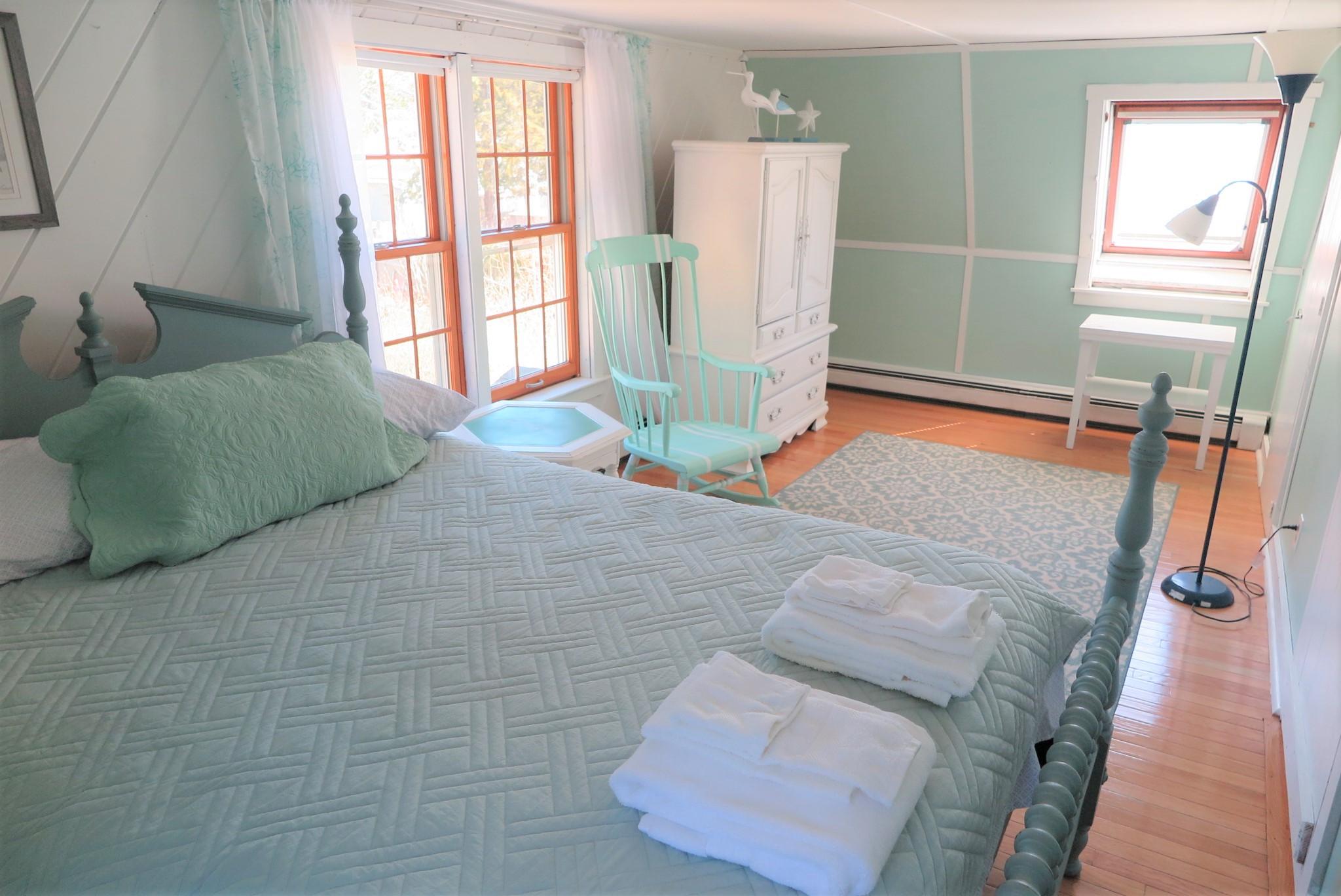 42 Bain Road Dennis Port, MA 02639 - Photo 23 of 46 a bedroom with a bed and a window