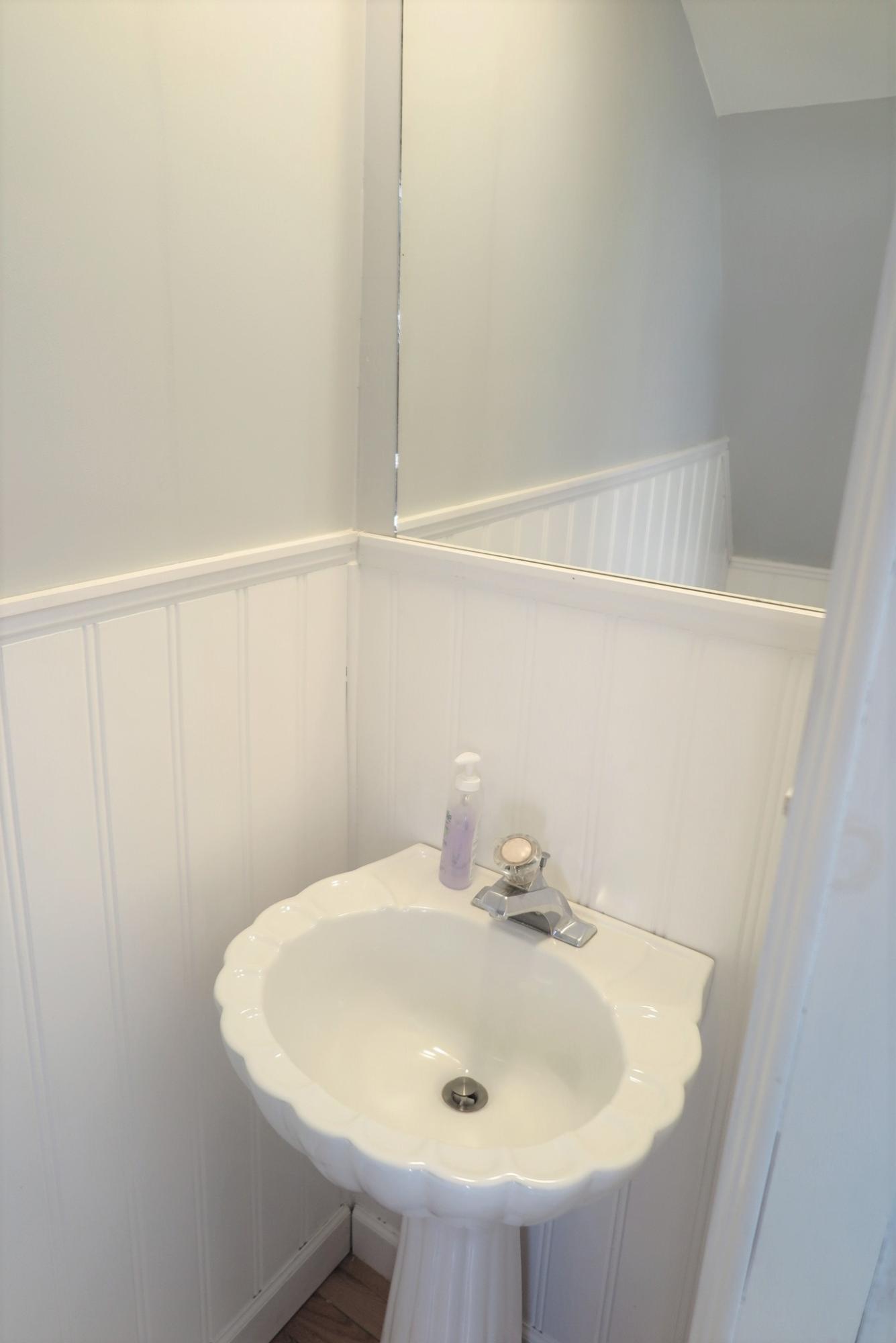 42 Bain Road Dennis Port, MA 02639 - Photo 26 of 46 a bathroom with a sink and a mirror