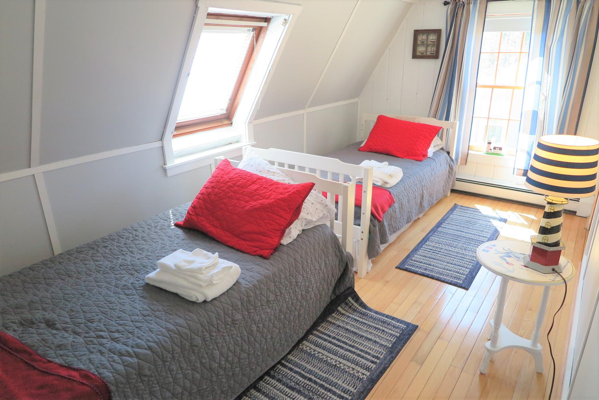 42 Bain Road Dennis Port, MA 02639 - Photo 28 of 46 a bed sitting in a bedroom next to a window