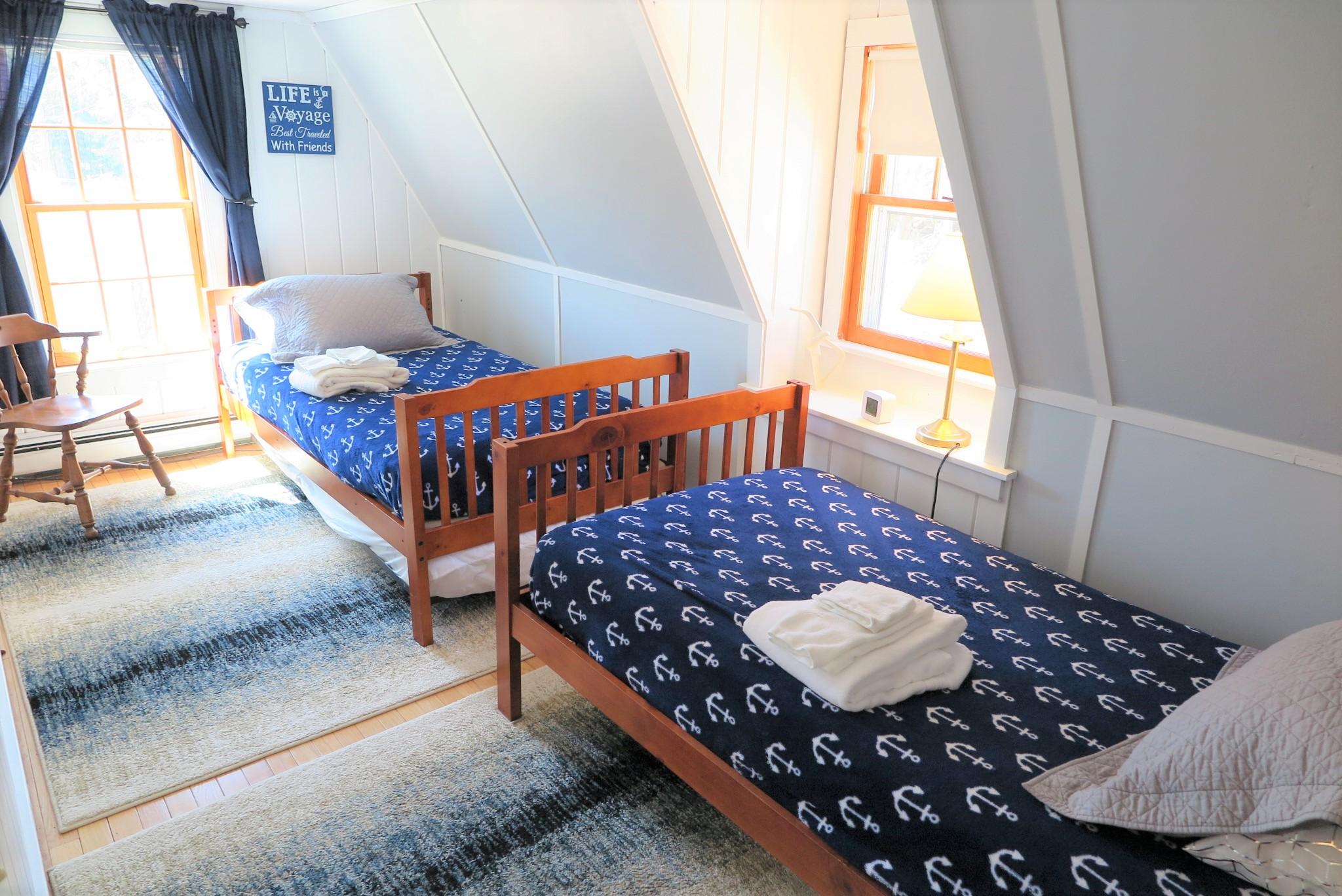 42 Bain Road Dennis Port, MA 02639 - Photo 31 of 46 a bed sitting in a bedroom next to a window