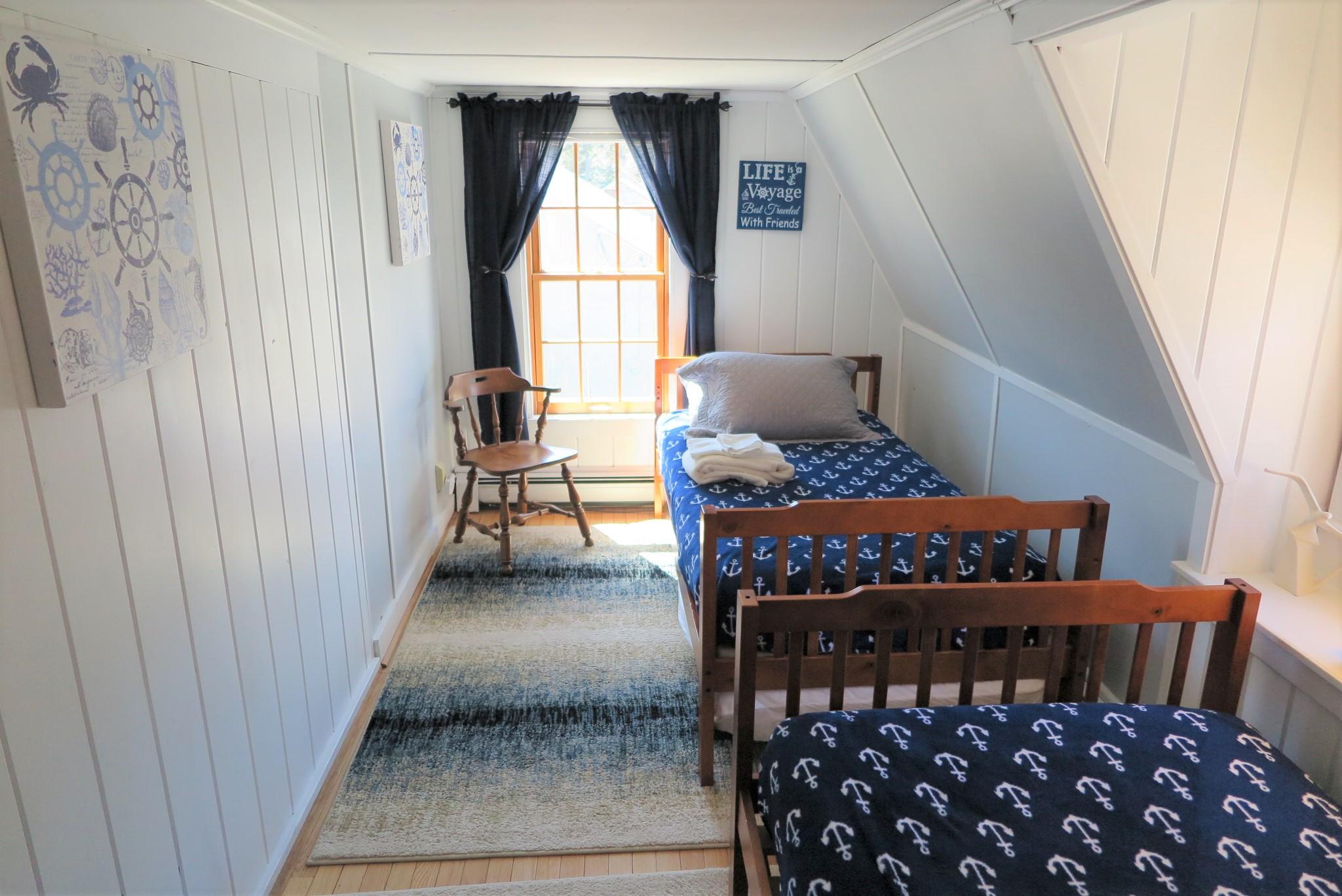 42 Bain Road Dennis Port, MA 02639 - Photo 32 of 46 a bedroom with a bed and a window