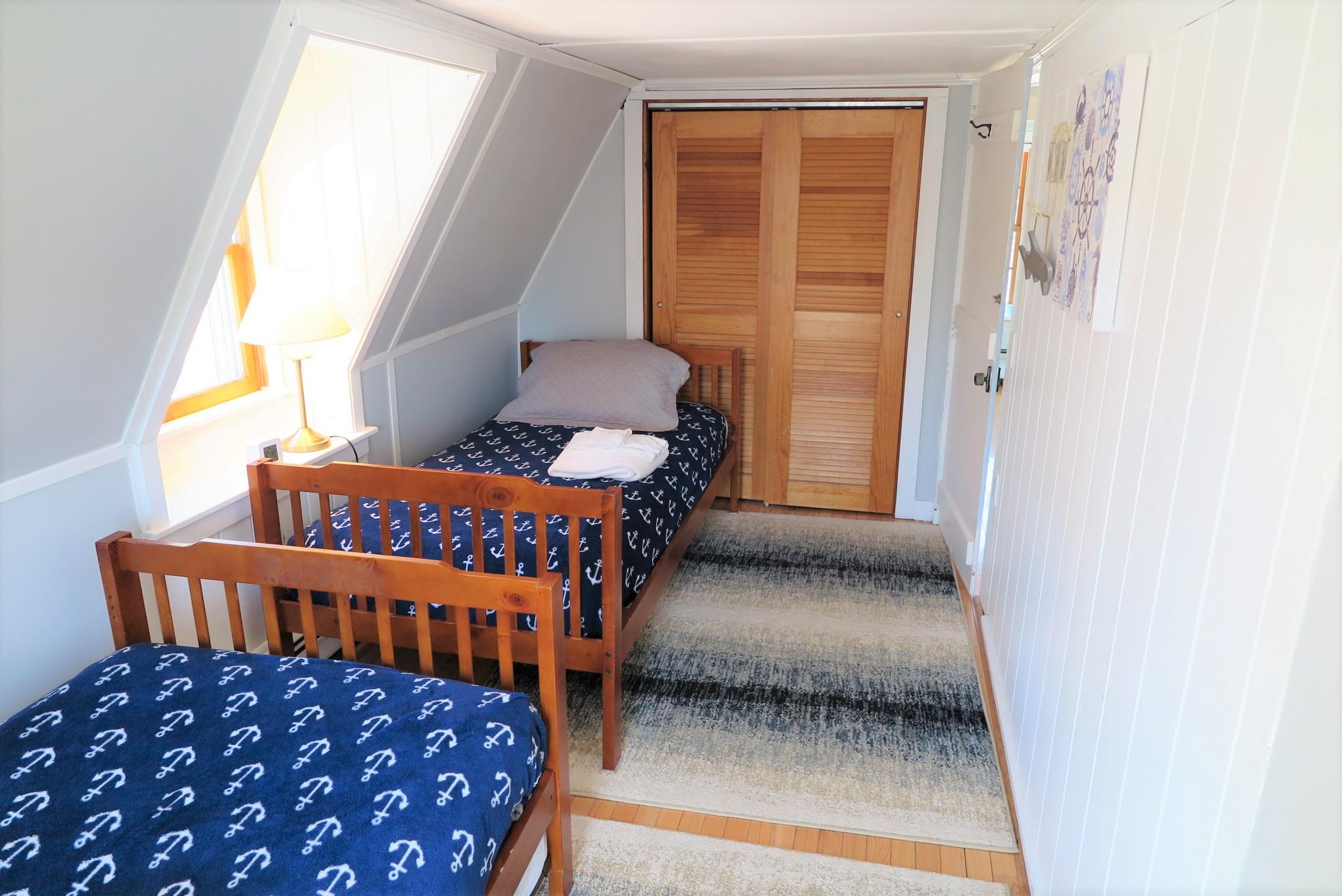 42 Bain Road Dennis Port, MA 02639 - Photo 33 of 46 a bedroom with two beds and a window
