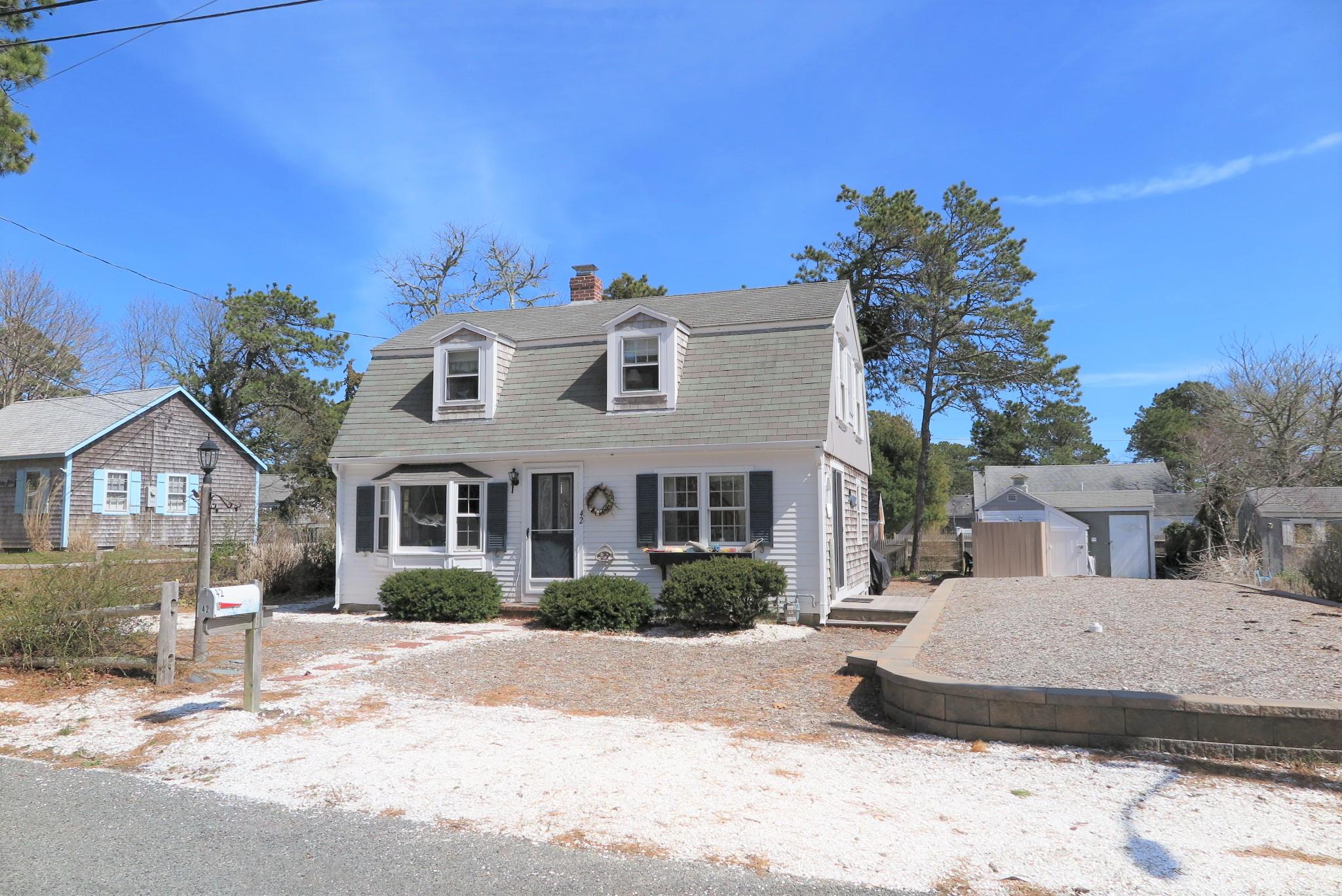 42 Bain Road Dennis Port, MA 02639 - Photo 37 of 46 a view of a house with a patio