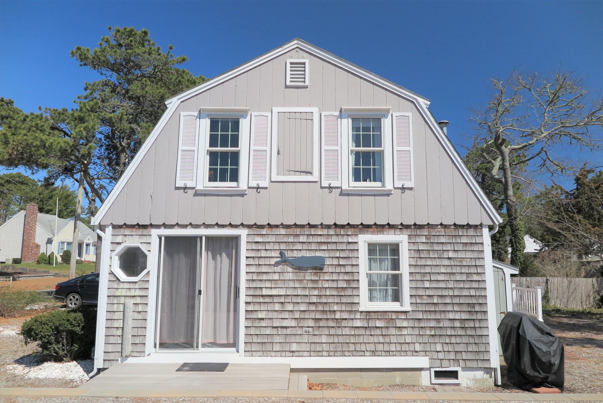 42 Bain Road Dennis Port, MA 02639 - Photo 39 of 46 a front view of a house with a yard