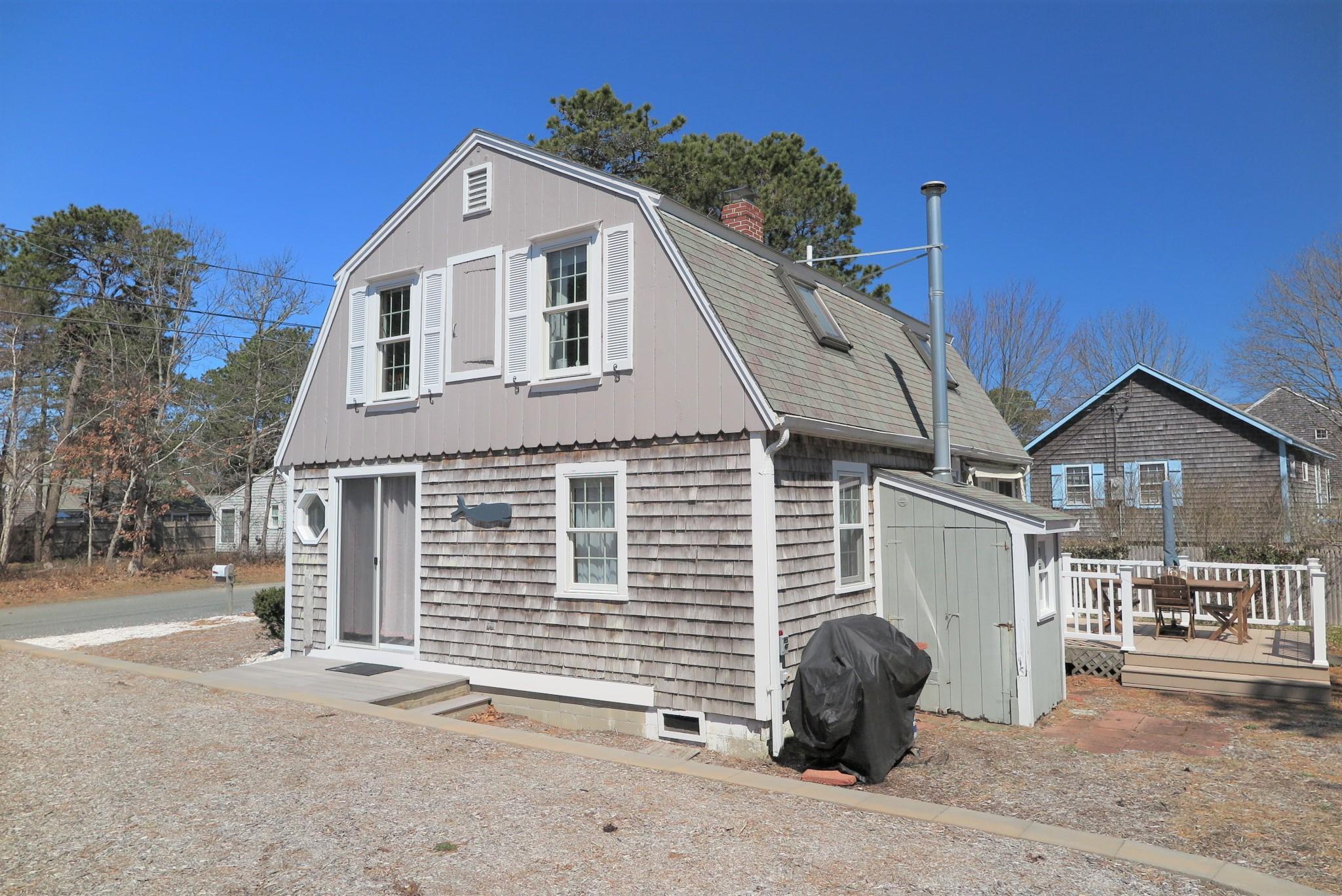 42 Bain Road Dennis Port, MA 02639 - Photo 40 of 46 a front view of a house with a garage