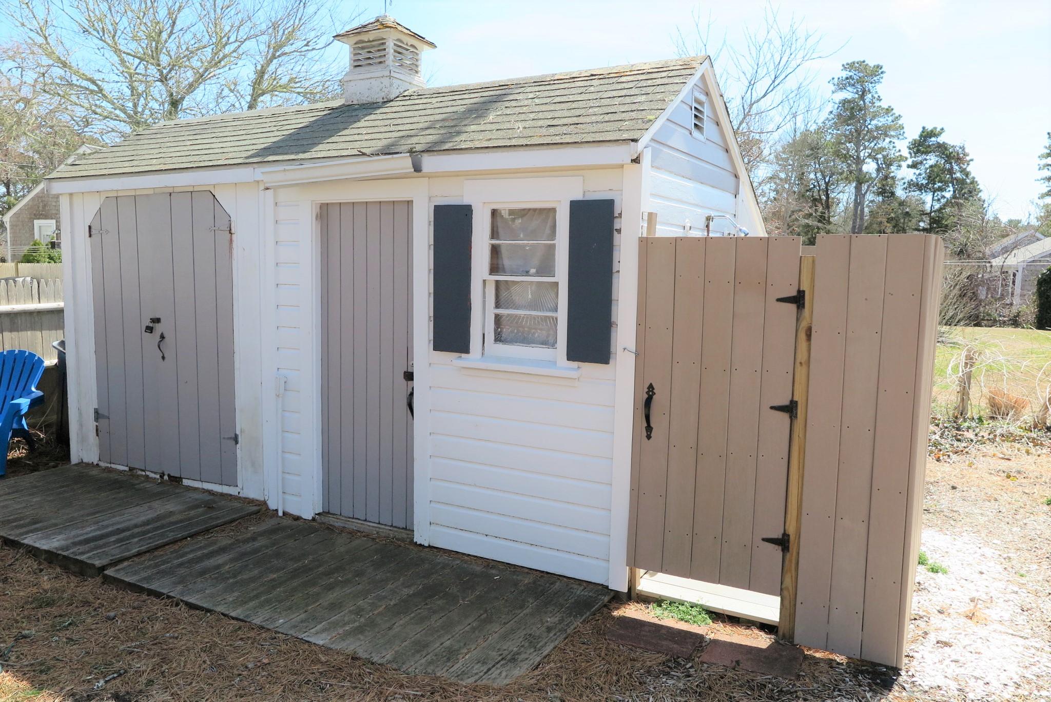 42 Bain Road Dennis Port, MA 02639 - Photo 44 of 46 a view of a house with a wooden fence