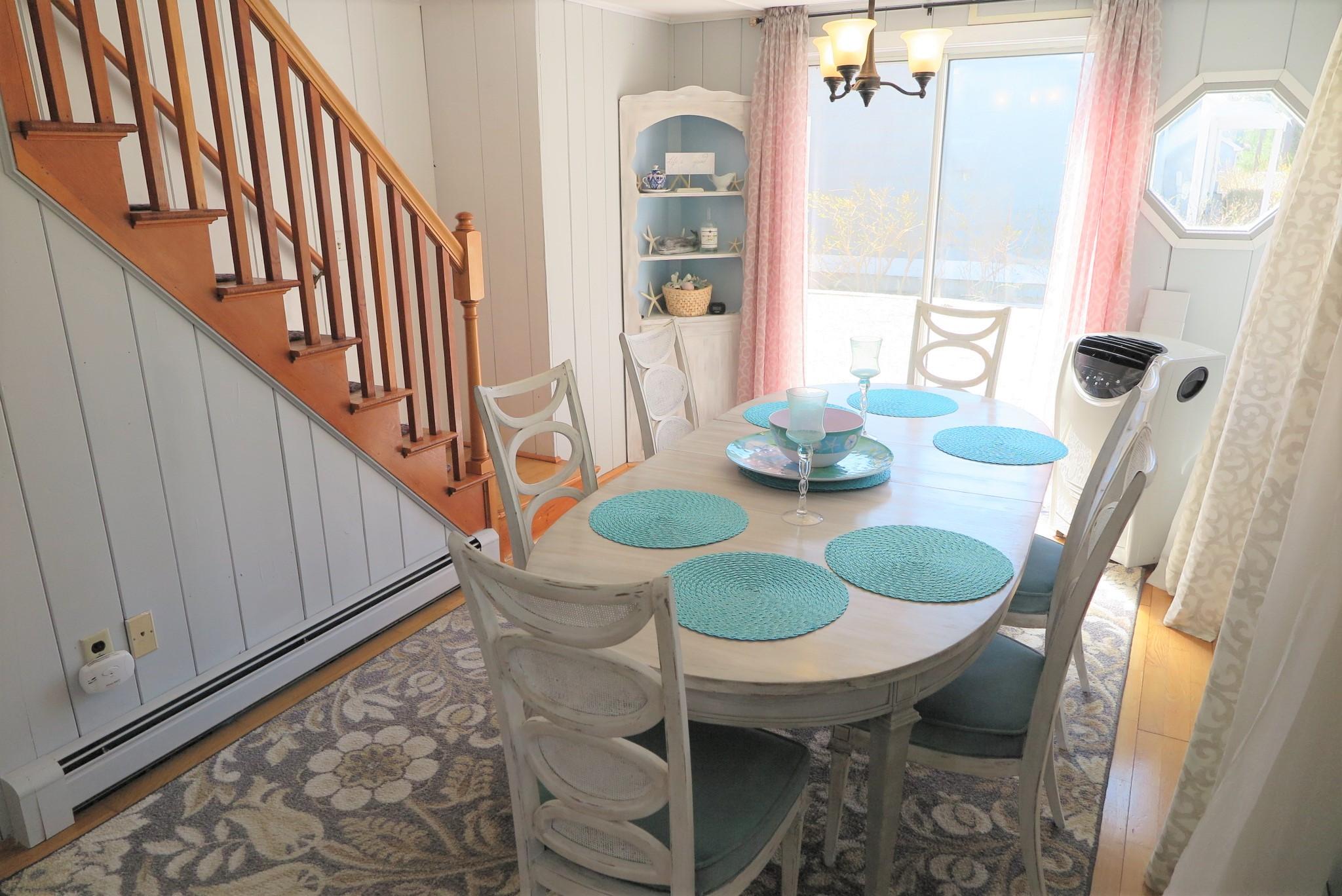42 Bain Road Dennis Port, MA 02639 - Photo 10 of 46 a dining room with furniture and wooden floor