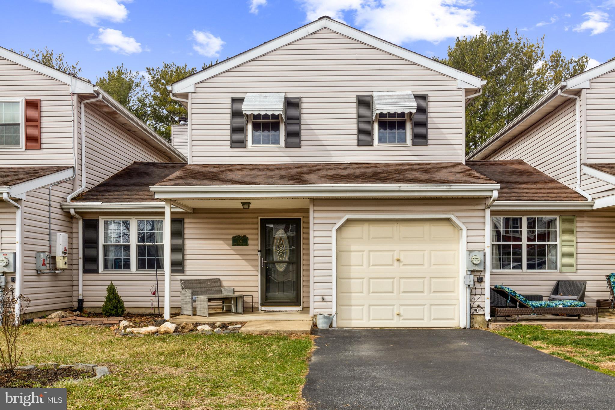 103 Upper Valley Lane Newark, DE 19711 - Photo 1 of 31 a front view of a house with swimming pool and chairs
