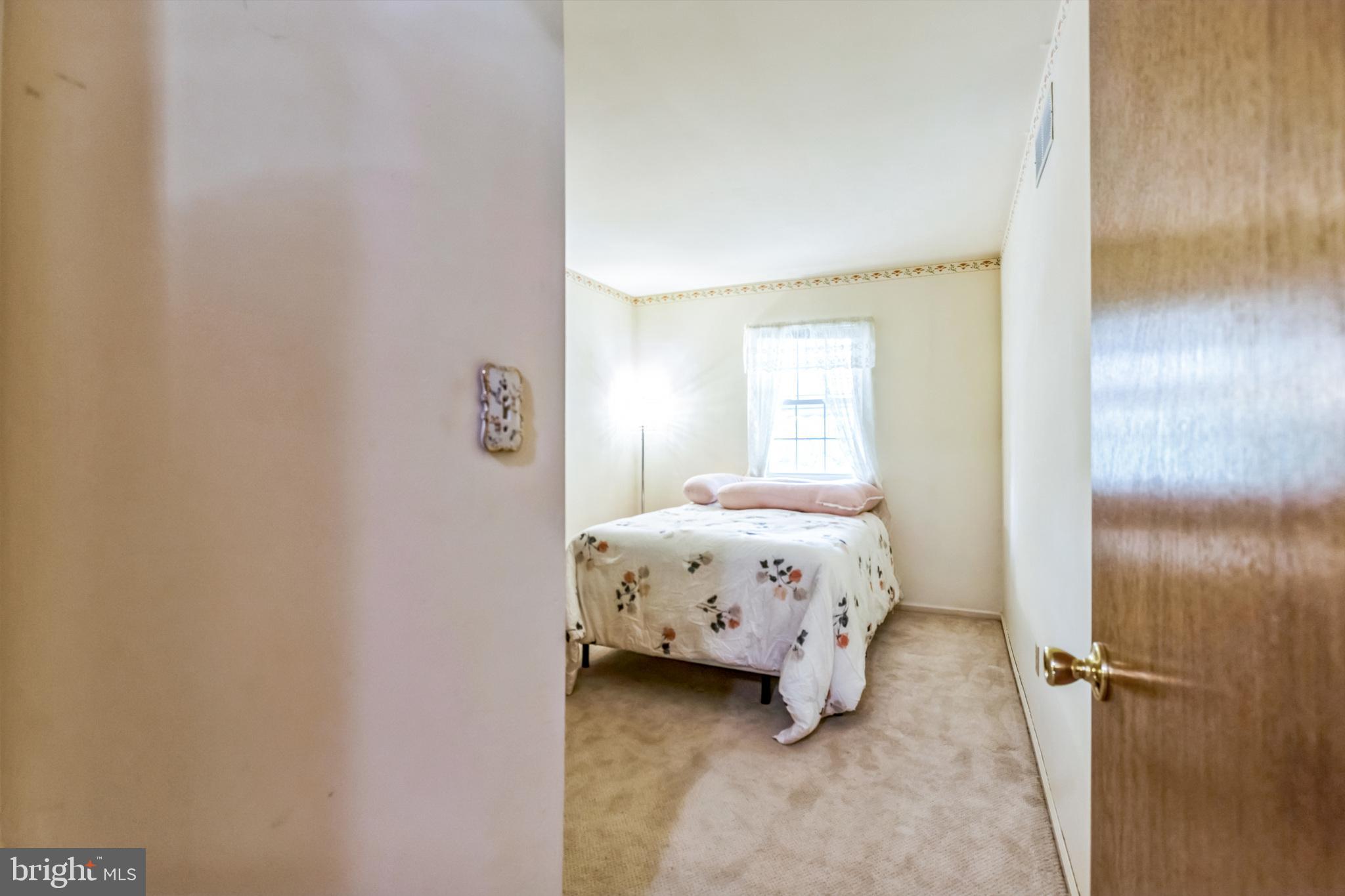 103 Upper Valley Lane Newark, DE 19711 - Photo 21 of 31 a bedroom with a bed and a window