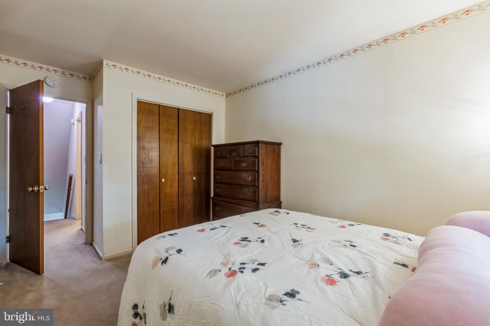 103 Upper Valley Lane Newark, DE 19711 - Photo 22 of 31 a bedroom with a bed and a dresser