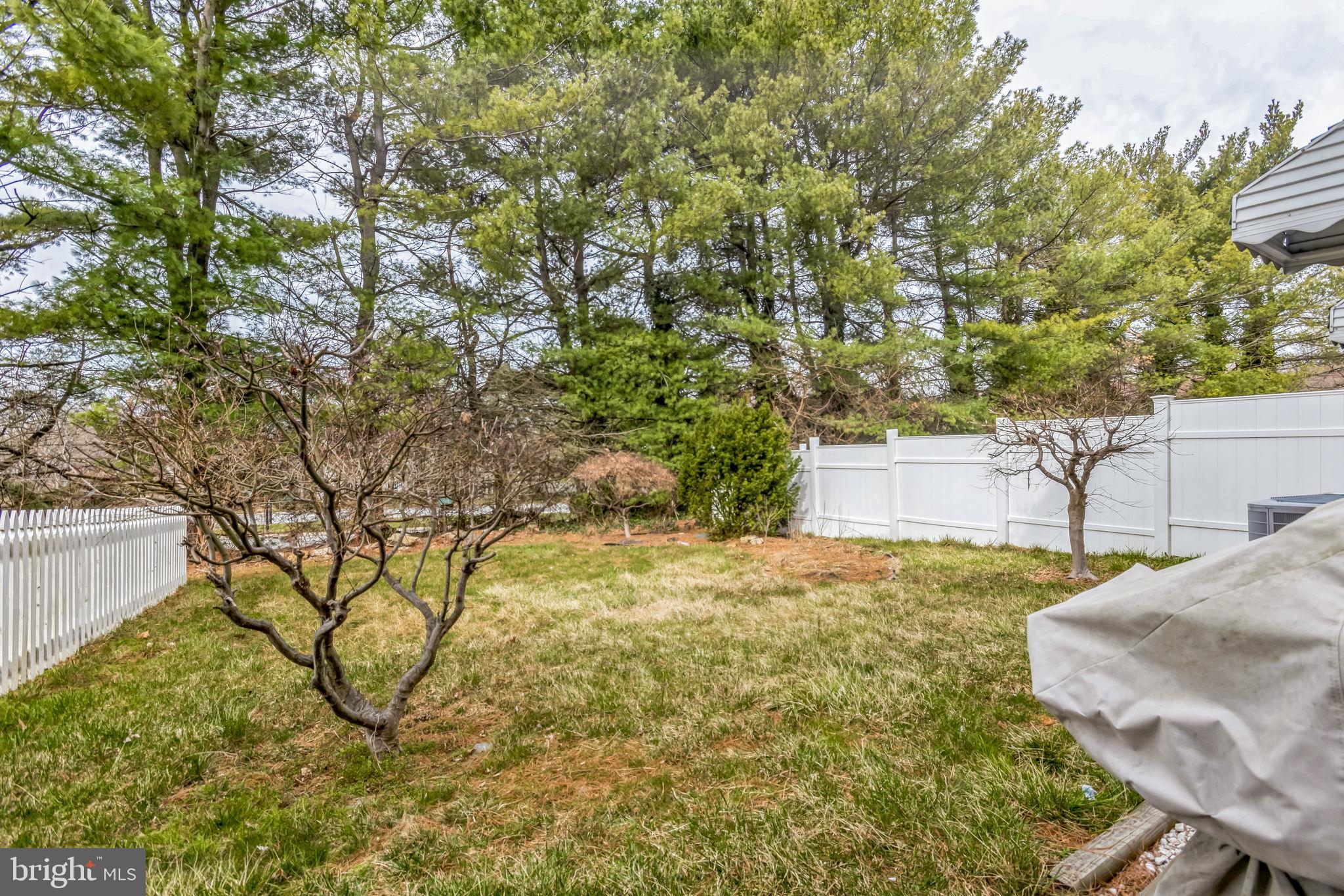 103 Upper Valley Lane Newark, DE 19711 - Photo 30 of 31 a yellow house with trees in front of it