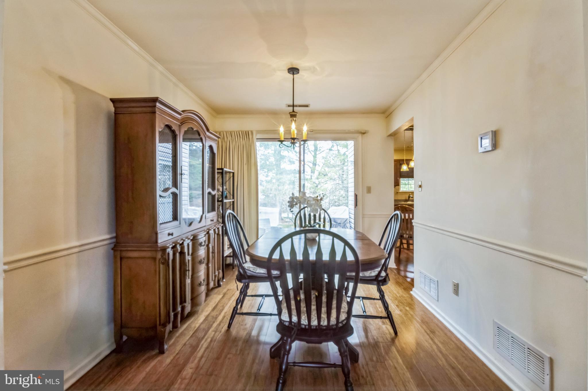103 Upper Valley Lane Newark, DE 19711 - Photo 8 of 31 a view of a dining room with furniture window and wooden floor