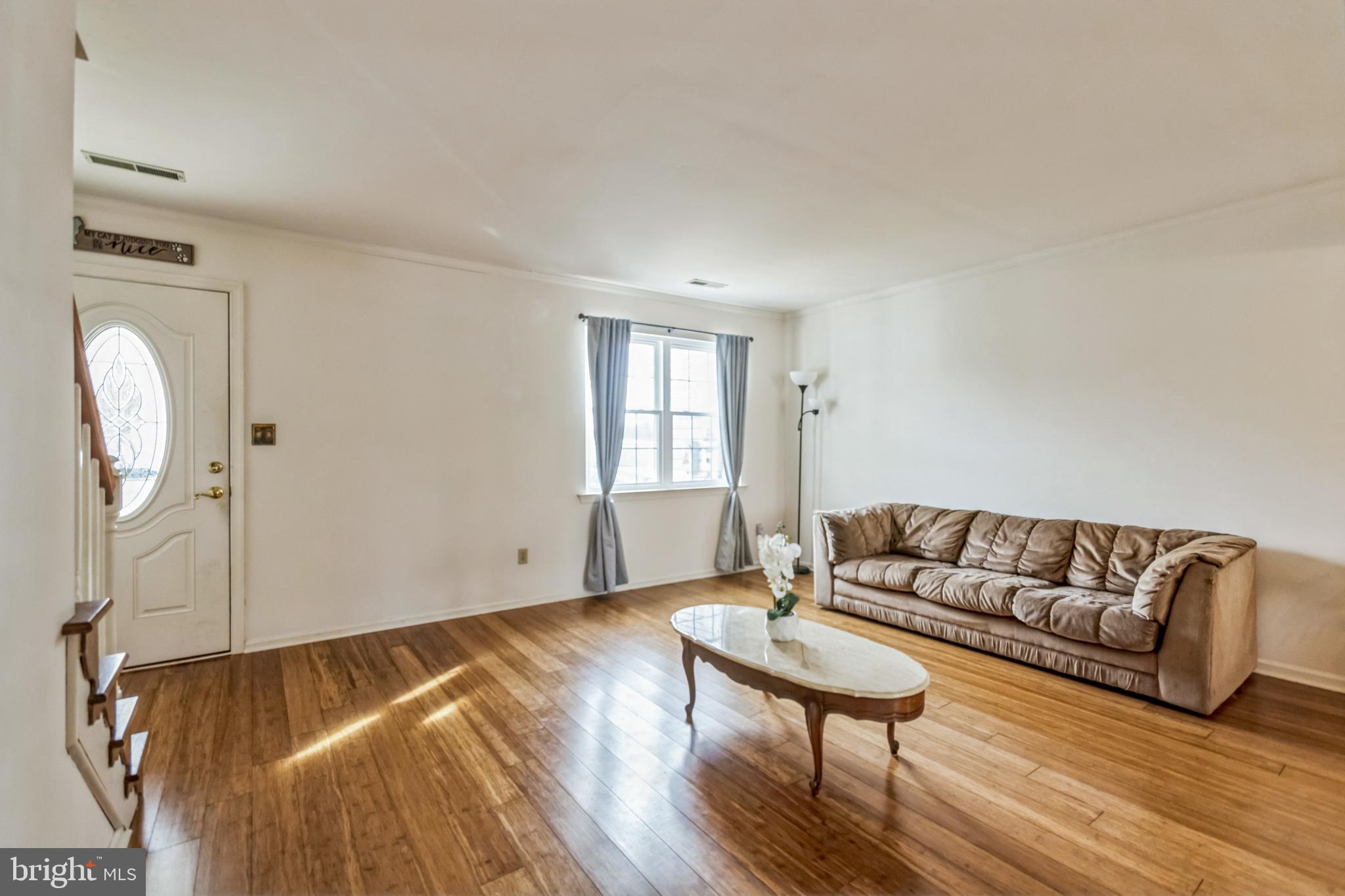 103 Upper Valley Lane Newark, DE 19711 - Photo 10 of 31 a living room with furniture and a wooden floor