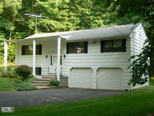a view of a backyard of the house
