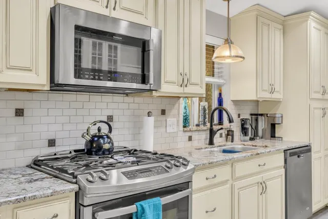 a kitchen with a refrigerator and countertop