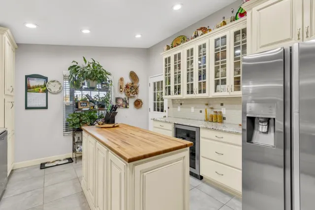 a kitchen with stainless steel appliances granite countertop a sink and a stove