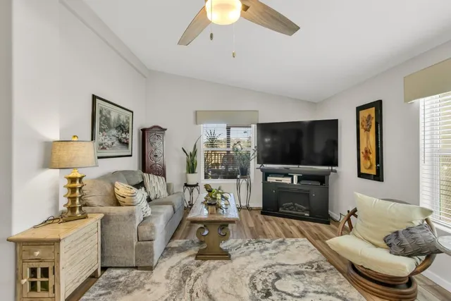 a living room with furniture and a large window