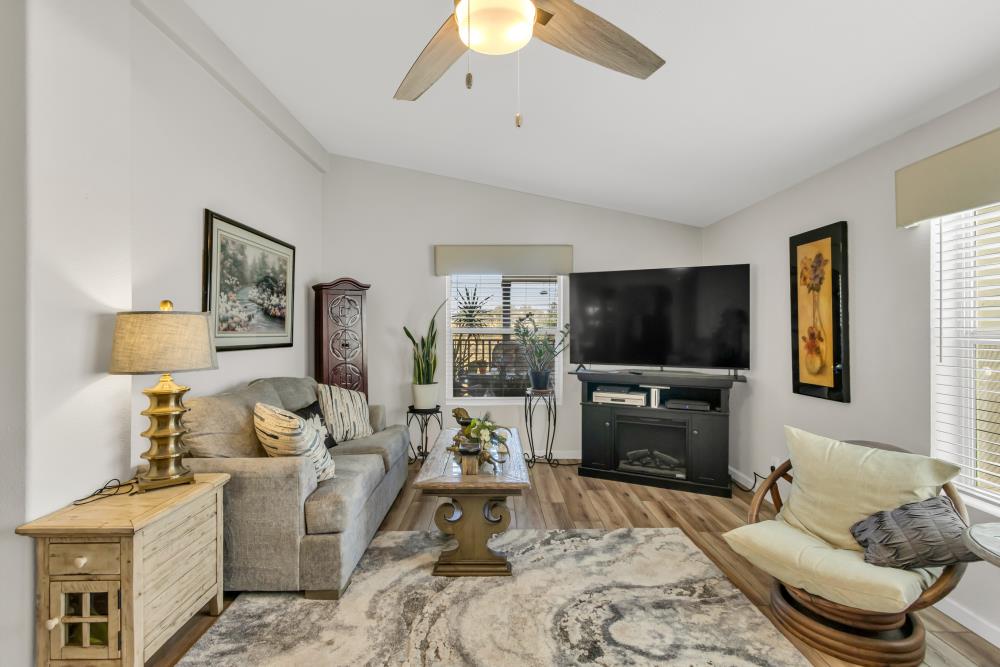 2000 Camanche Road, Unit 31 Ione, CA 95640 - Photo 26 of 43 a living room with furniture a flat screen tv and a fireplace