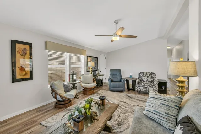 a living room with furniture a couch and a table