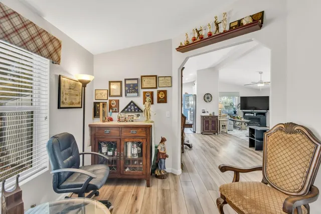 a view of a dining room with furniture window and wooden floor