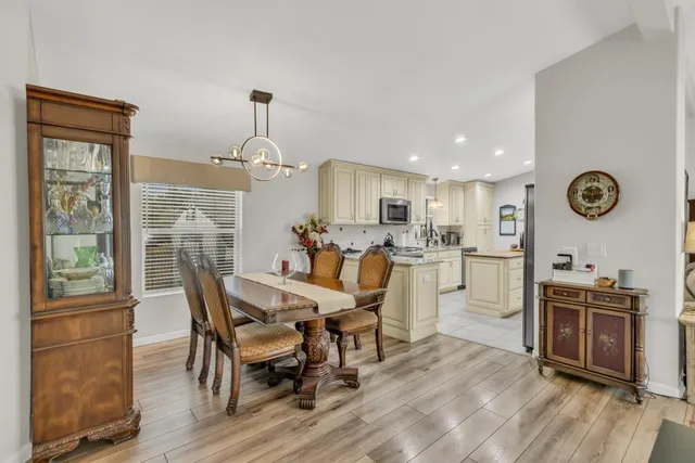 a dining room with furniture and window