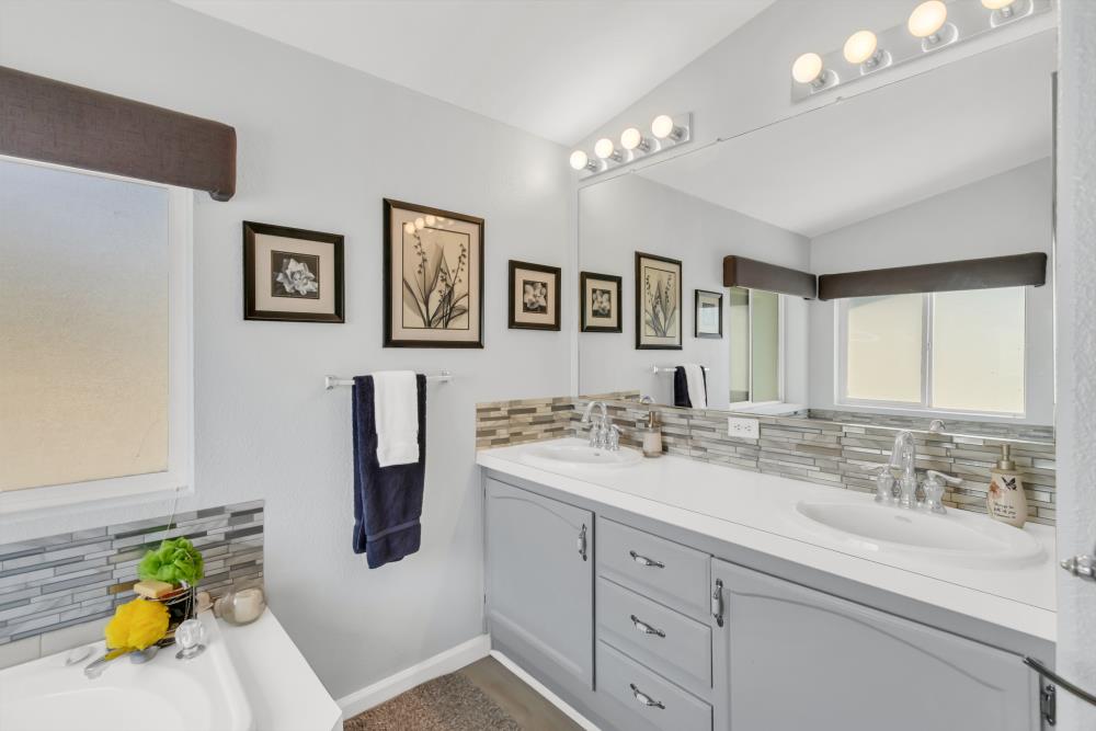 2000 Camanche Road, Unit 31 Ione, CA 95640 - Photo 36 of 43 a bathroom with a sink double vanity and window