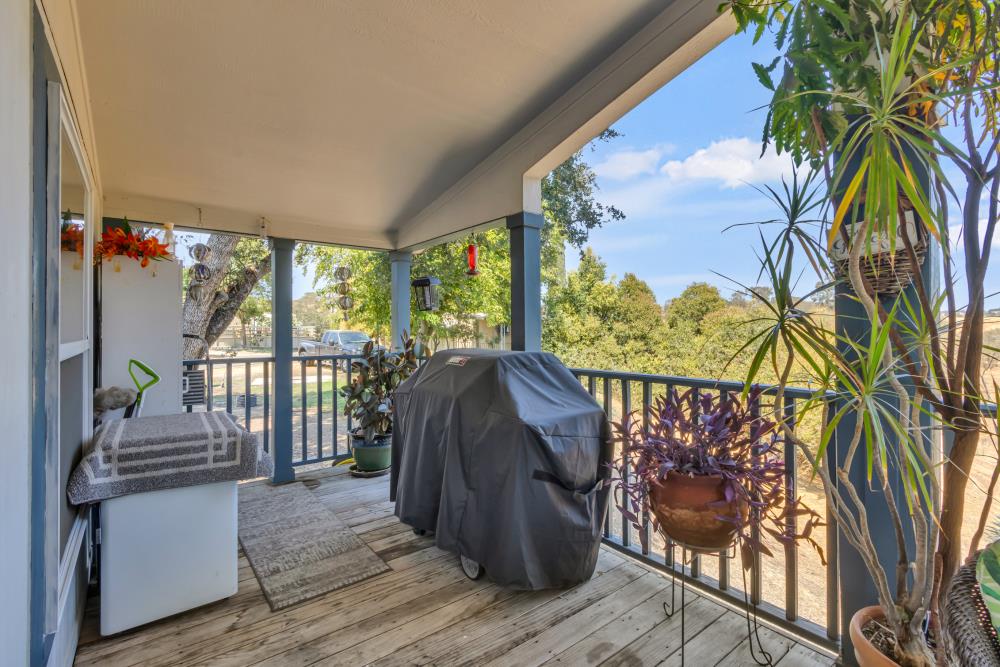 2000 Camanche Road, Unit 31 Ione, CA 95640 - Photo 6 of 43 a living room filled with furniture and a floor to ceiling window