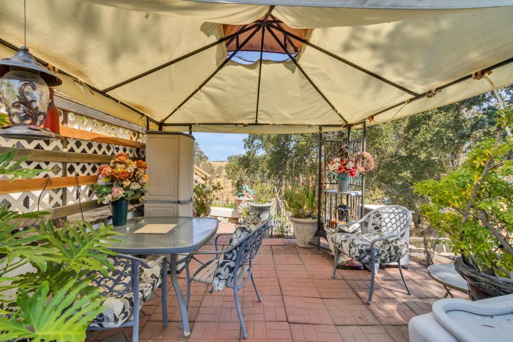 2000 Camanche Road, Unit 31 Ione, CA 95640 - Photo 7 of 43 a table and chairs in front of a building