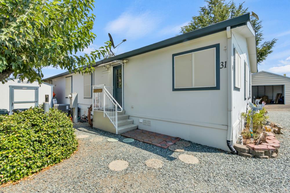 2000 Camanche Road, Unit 31 Ione, CA 95640 - Photo 8 of 43 a front view of a house with garden