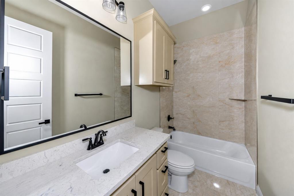 1057 Vh Ranch Poolville, TX 76487 - Photo 27 of 38 a bathroom with a sink toilet tub and shower