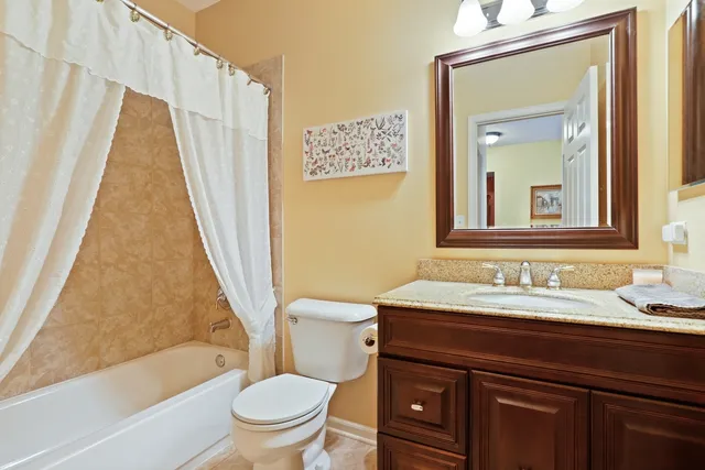 a bathroom with a sink a toilet and a bathtub