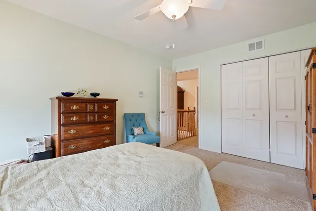 a bedroom with a bed and a closet