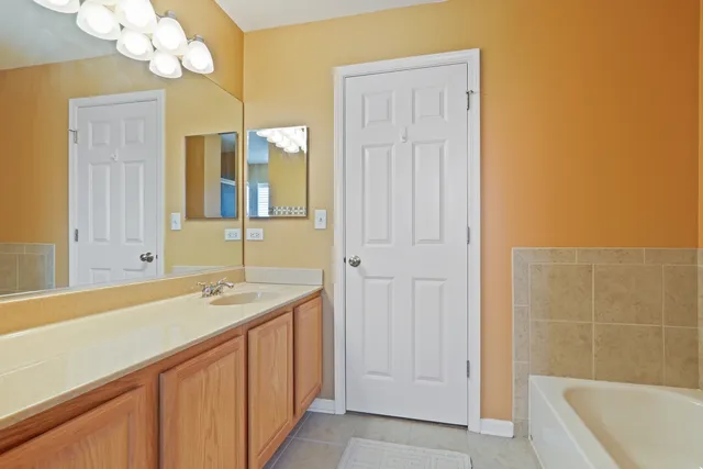 a bathroom with a sink a vanity and a mirror