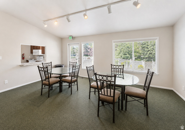 6907 South 745th Street East, Unit G Midvale, UT 84047 - Photo 25 of 30 Clubhouse contains eating area and separate kitchen with pass-thru