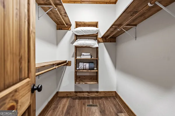 a bathroom with a granite countertop sink a toilet and a mirror