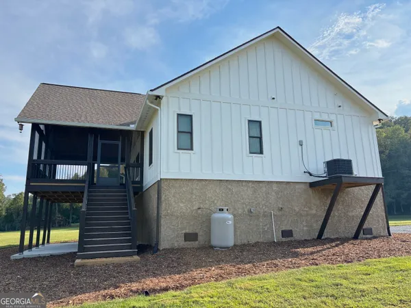 a view of house with yard