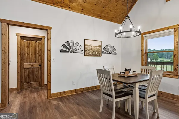 a bedroom with a bed table and a window