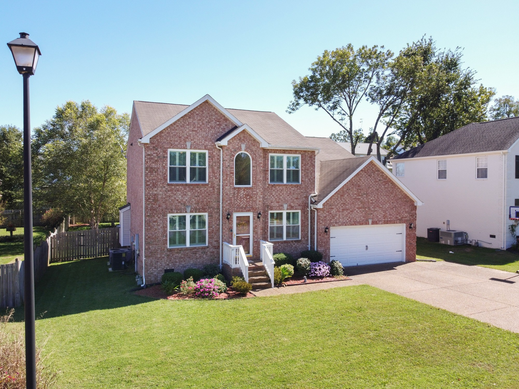 4007 Timber Ridge Court Mount Juliet, TN 37122 - Photo 2 of 36 a front view of a house with a yard and garage