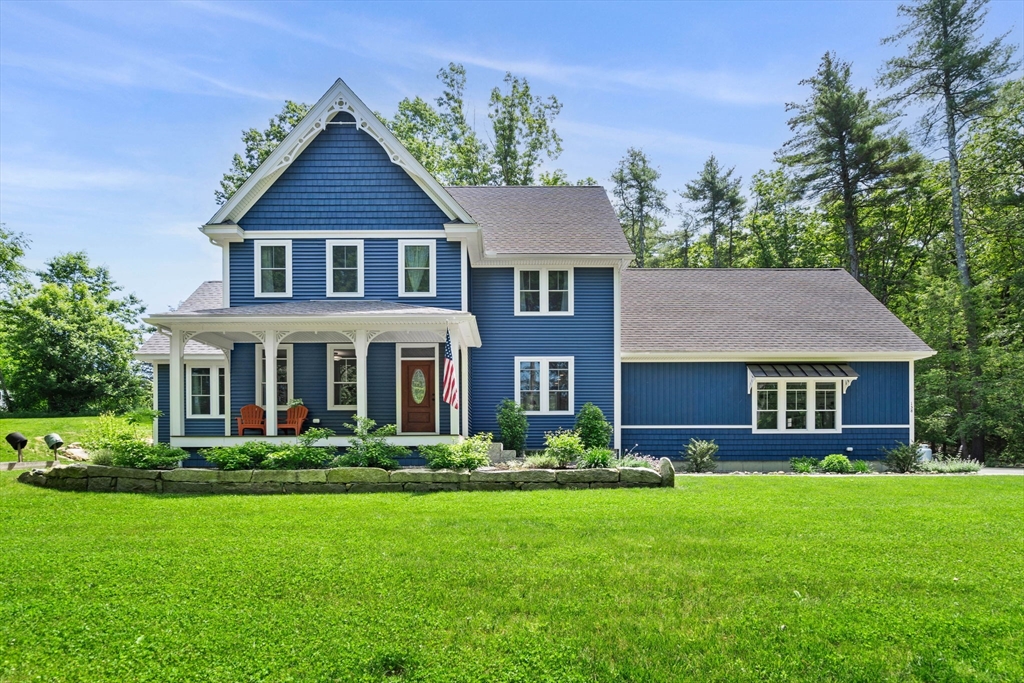 158 Warren Road Townsend, MA 01469 - Photo 1 of 41 a front view of a house with a yard and trees