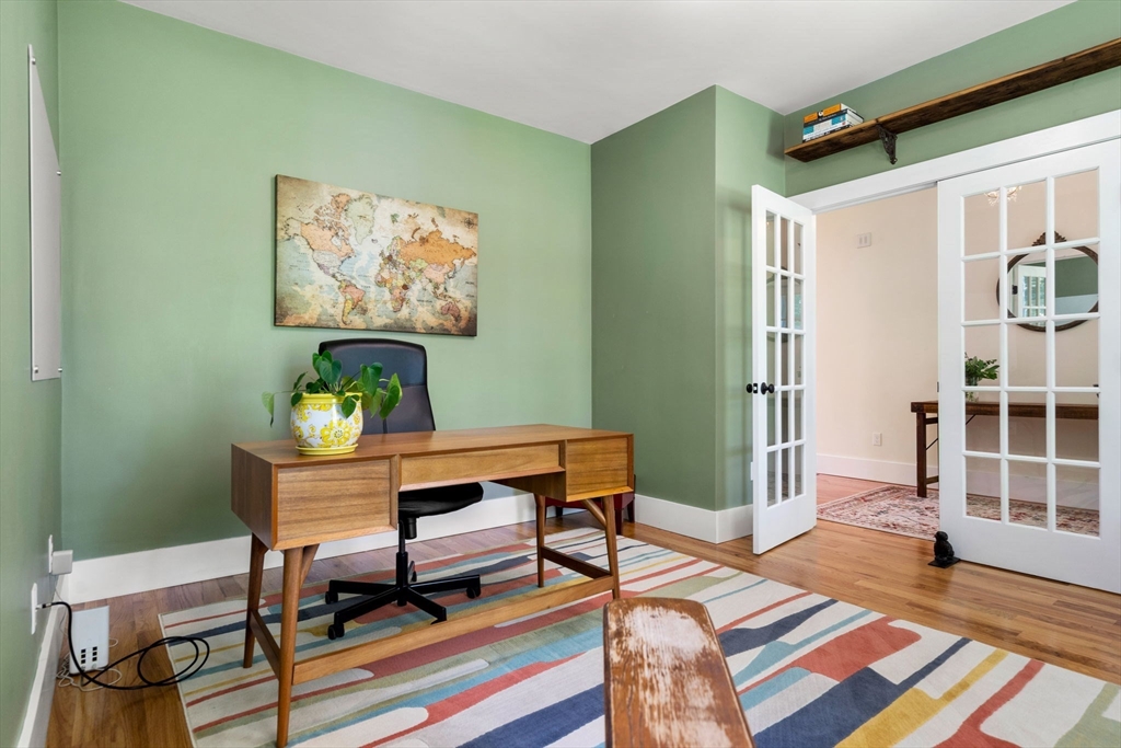 158 Warren Road Townsend, MA 01469 - Photo 17 of 41 a workspace with furniture and wooden floor